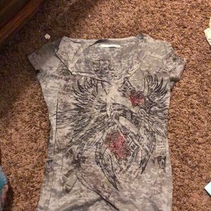 Maurice’s grey shirt